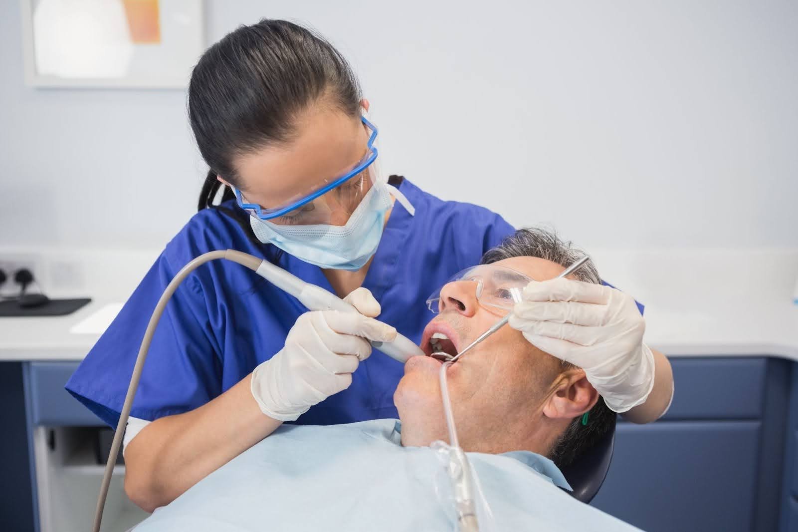 Dental clinician examining a patient