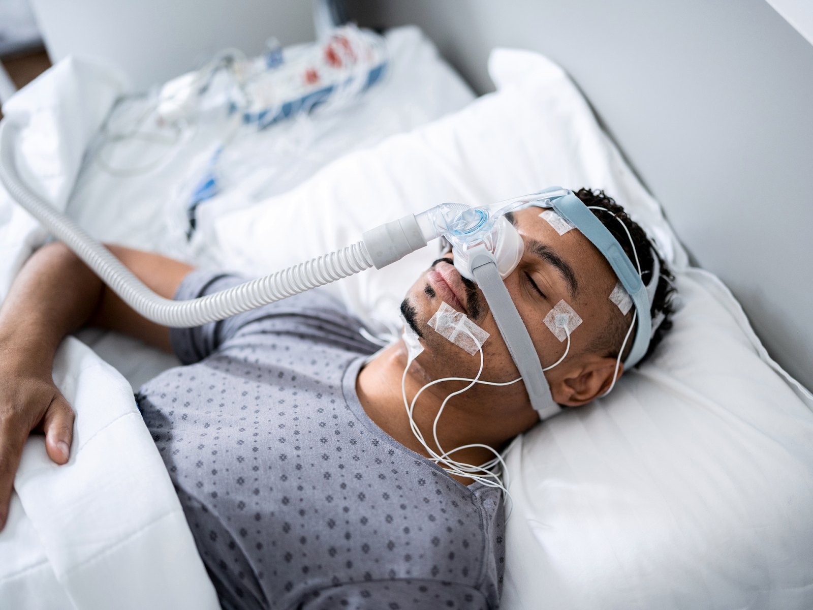 Patient wearing a breathing mask during a sleep study